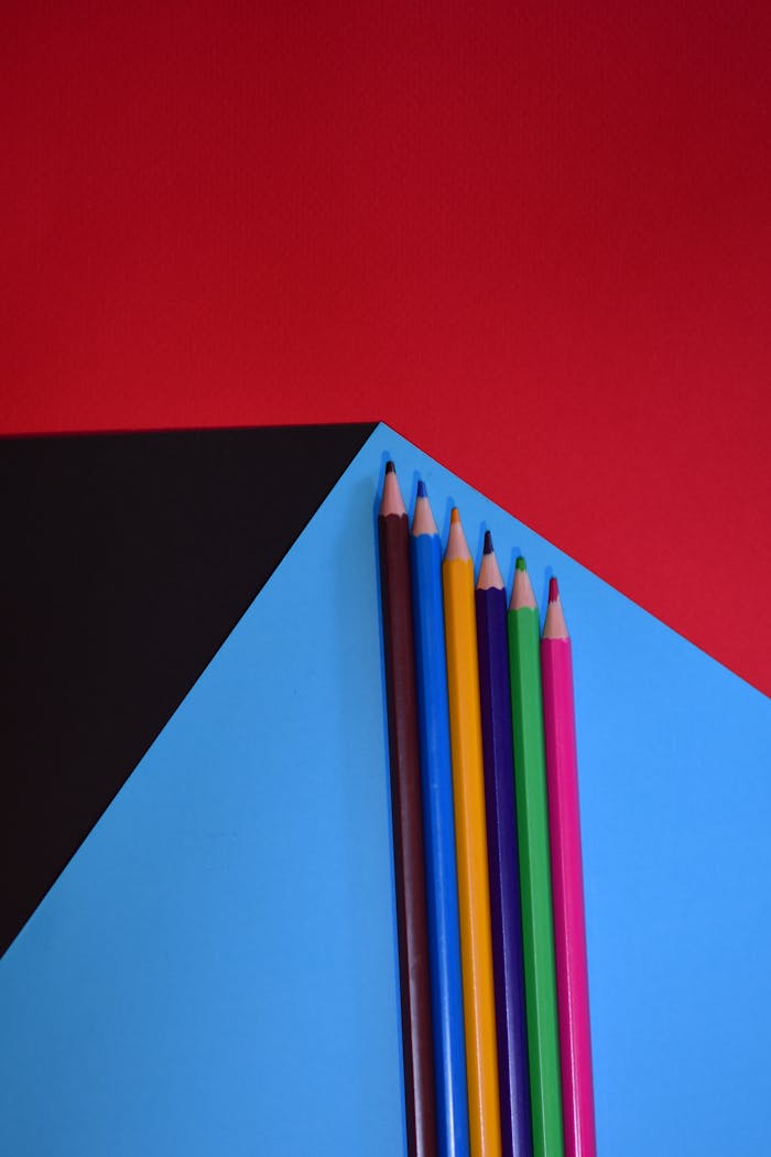 colorful-pencils-on-vibrant-background-33909727